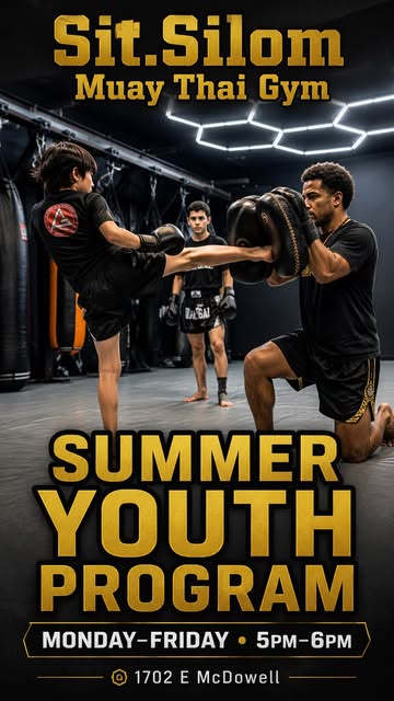 A young student throws a kick into pads held by a coach